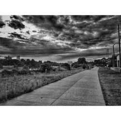 View of road against cloudy sky