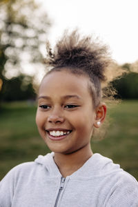 Happy girl smiling in playground