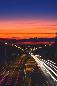 High angle view of light trails on road at night