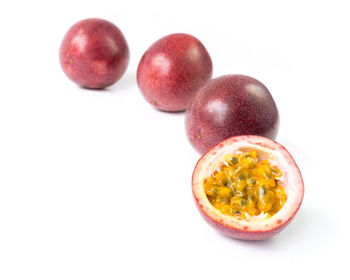 Close-up of fruits over white background