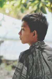 Close-up portrait of boy standing outdoors