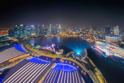 High angle view of illuminated city buildings at night
