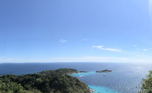 High angle view of sea against blue sky