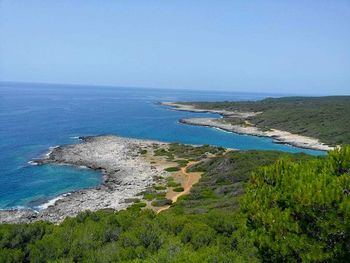 Scenic view of sea against blue sky