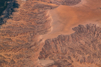 Aerial view of rocky mountains on sunny day