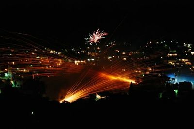 Firework display at night