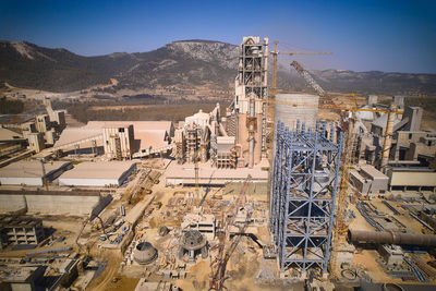Structures of cement producing plant. aerial view of huge industrial factory.