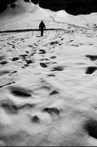 Silhouette of people on snow covered landscape