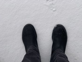 Low section of person wearing shoes standing outdoors