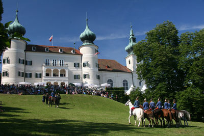 People on town square against sky