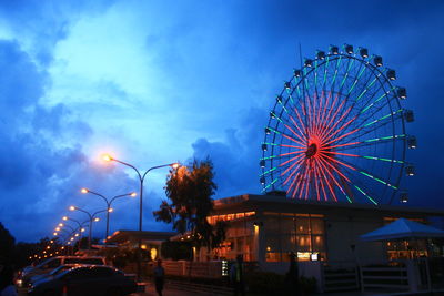 Low angle view of ferris wheel against sky at night