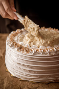 Cropped hand of person preparing food