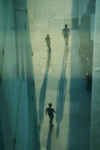 Statue of man standing on wall
