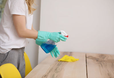 Midsection of woman working at home