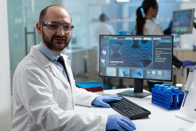 Portrait of smiling scientist working at laboratory