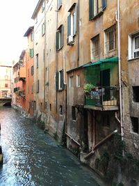 Canal amidst buildings in city