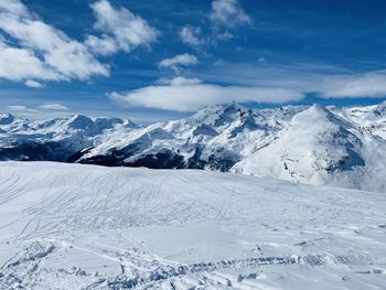 Scenic view of snowcapped mountains against sky