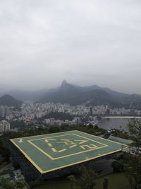 Aerial view of cityscape against sky