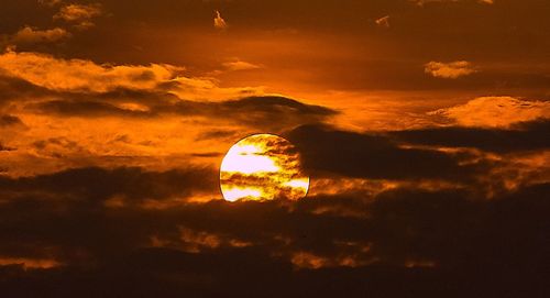 Low angle view of dramatic sky during sunset