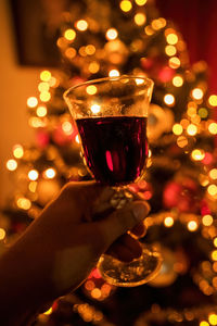 Cropped hand of woman holding wineglass