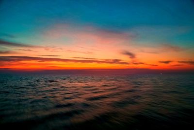 Scenic view of sea against romantic sky at sunset
