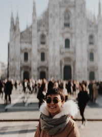 Smiling woman against milan cathedral