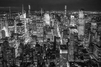 High angle view of buildings in city at night