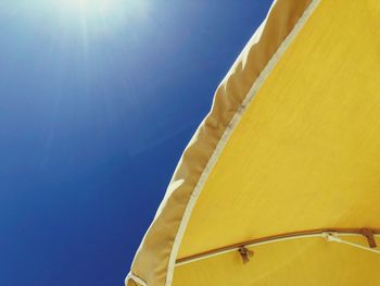 Low angle view of yellow wall against clear sky
