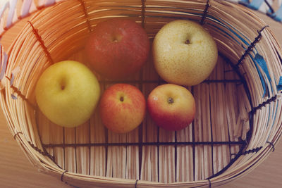 Close-up of fruits in basket on table