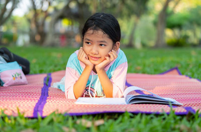 Portrait of girl on book