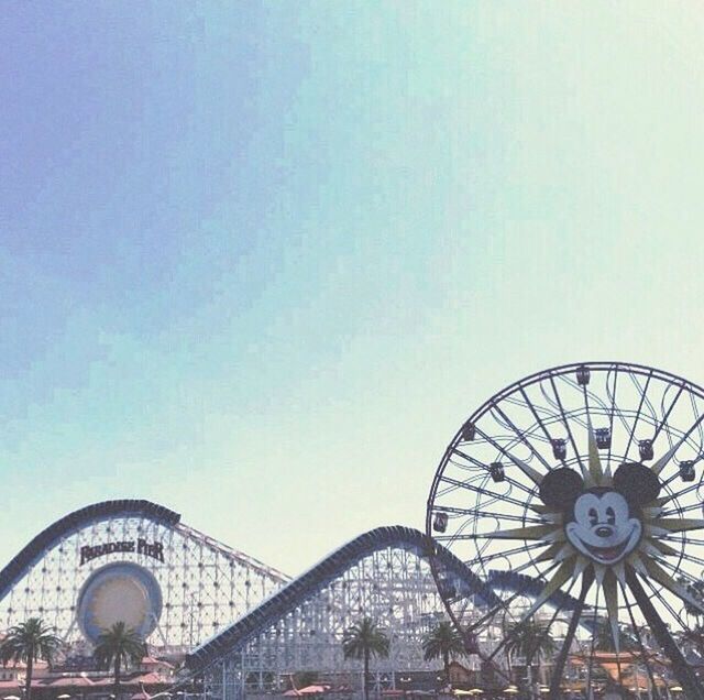 clear sky, built structure, architecture, copy space, low angle view, ferris wheel, building exterior, amusement park, amusement park ride, arts culture and entertainment, day, outdoors, sky, transportation, metal, no people, travel, travel destinations, high section, circle