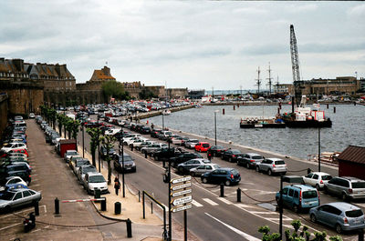 Panoramic view of harbor against sky in city