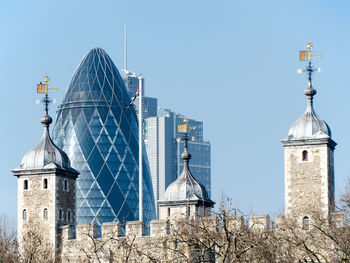 Low angle view of tower against blue sky
