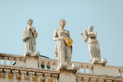 Low angle view of statue against sky