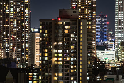 Illuminated buildings in city at night