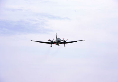 Low angle view of airplane flying in sky