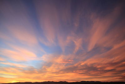 Low angle view of dramatic sky during sunset