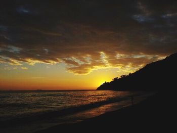 Scenic view of sea against dramatic sky