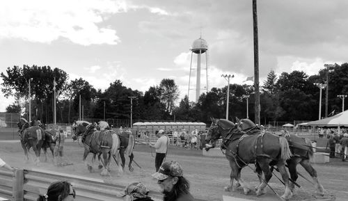 Panoramic view of people in city against sky