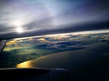 Aerial view of cloudscape over airplane wing