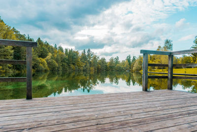 Pier over lake against sky