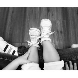 Low section of woman sitting on sofa