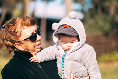 Portrait od grandmother and grandson sunny day