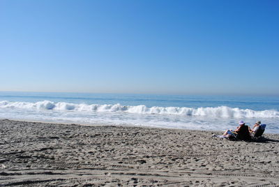 Scenic view of beach against clear sky