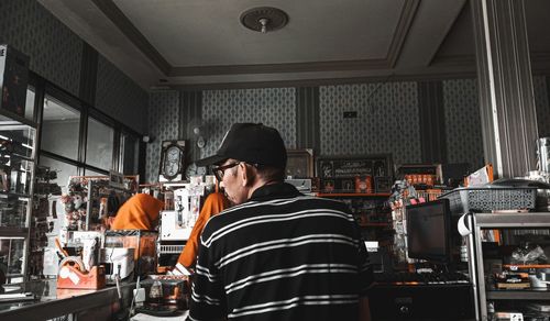 Rear view of man working at restaurant