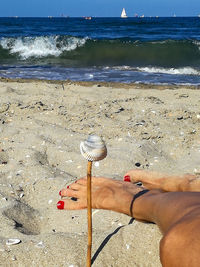 Person holding sand on beach