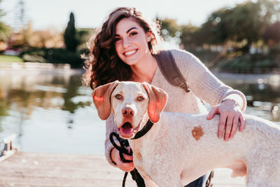 Portrait of young woman with dog