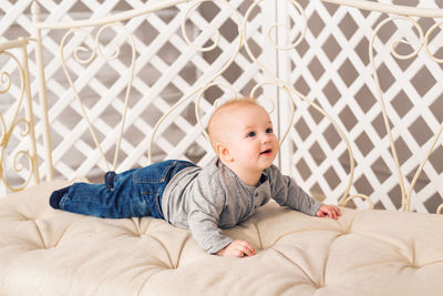 Cute baby lying on bed