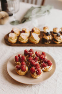 High angle view of strawberries in plate on table