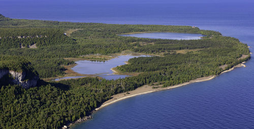 High angle view of sea shore against sky